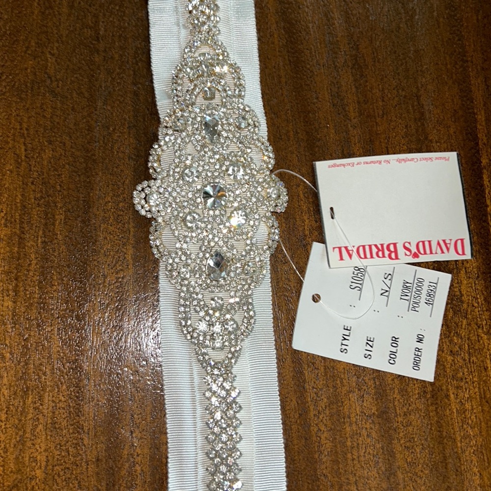 David’s Bridal wedding sash with shimmering crystals. Ivory with ribbon tie